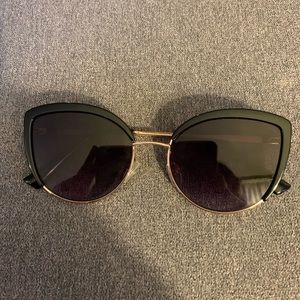 Ett twa black and gold sunglasses